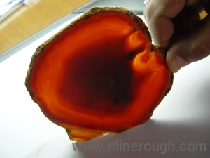 orange dyed banded agate sliced rough